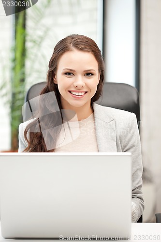 Image of happy woman with laptop computer