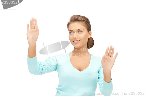 Image of businesswoman working with something imaginary