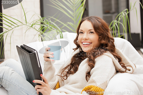 Image of happy woman with tablet pc computer