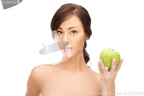 Image of young beautiful woman with green apple