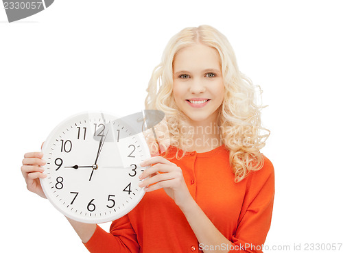 Image of woman holding big clock