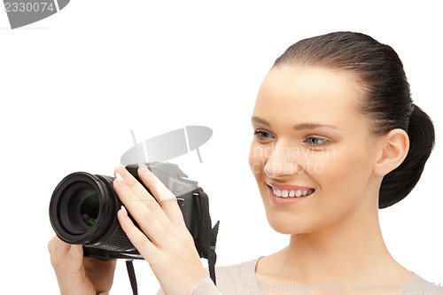 Image of teenage girl with digital camera