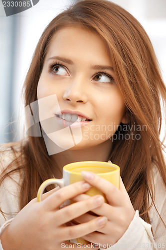 Image of lovely woman with mug