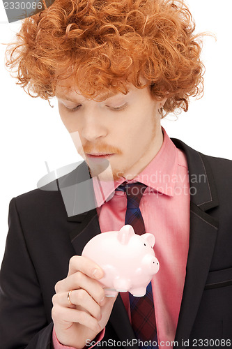 Image of man with piggy bank