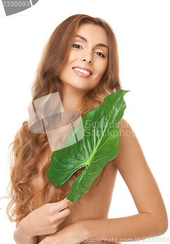 Image of woman with green leaf