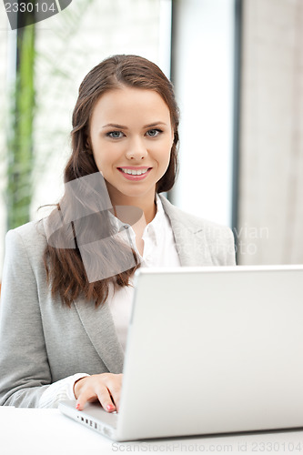Image of happy woman with laptop computer