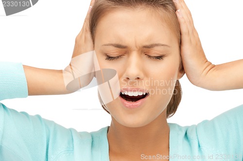 Image of woman with hands on ears