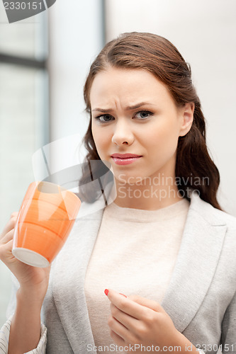 Image of lovely businesswoman with mug