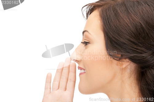 Image of woman whispering gossip