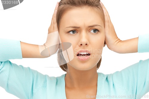 Image of woman with hands on ears