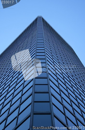 Image of Angle view of a glass-windowed skyscraper