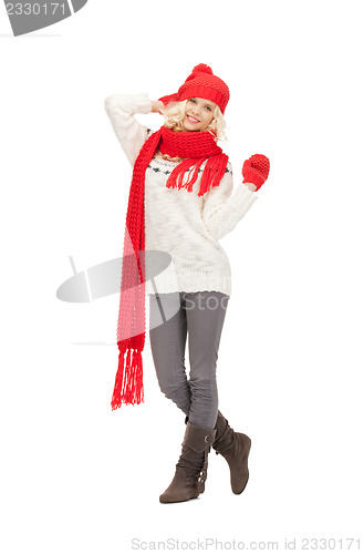 Image of beautiful woman in hat, muffler and mittens