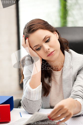 Image of calm woman with book