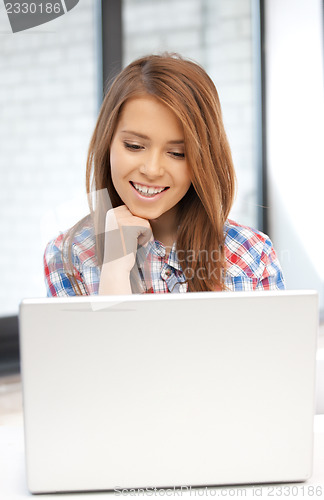 Image of happy woman with laptop computer