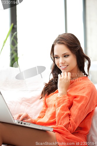 Image of happy woman with laptop computer