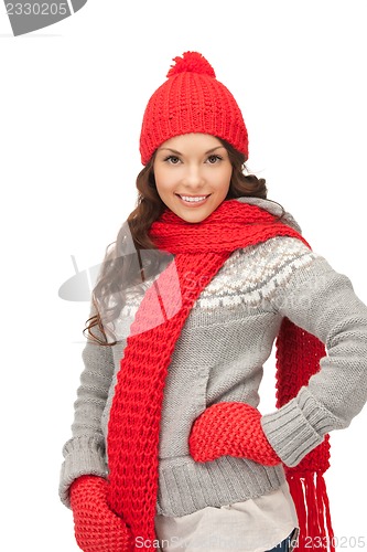 Image of beautiful woman in hat, muffler and mittens