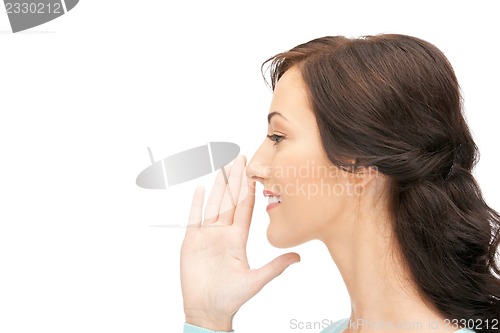 Image of woman whispering gossip