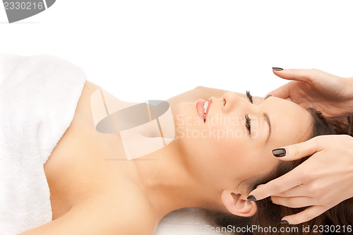 Image of beautiful woman in massage salon