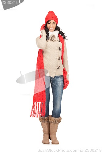 Image of beautiful woman in hat, muffler and mittens