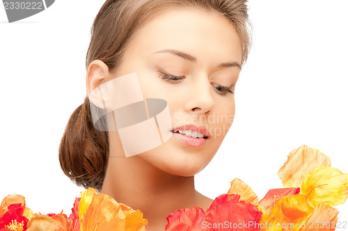 Image of lovely woman with red flowers