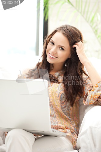 Image of happy woman with laptop computer