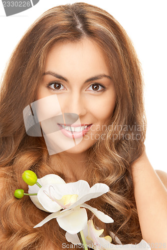 Image of beautiful woman with orchid flower