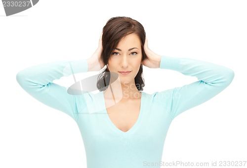 Image of woman with hands on ears