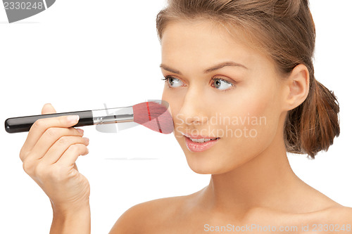 Image of beautiful woman with brush