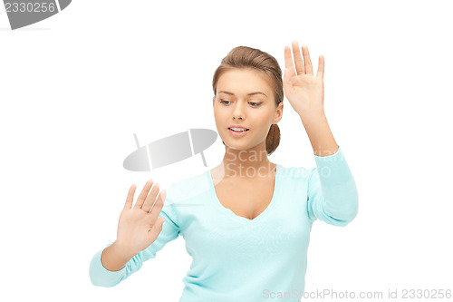 Image of businesswoman working with something imaginary