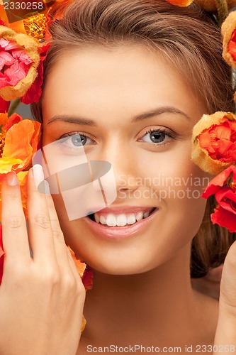 Image of lovely woman with red flowers