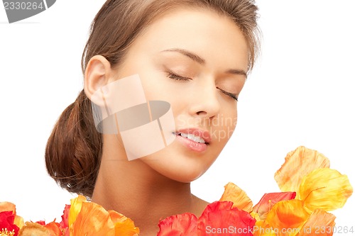 Image of lovely woman with red flowers