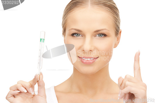 Image of attractive female doctor with thermometer