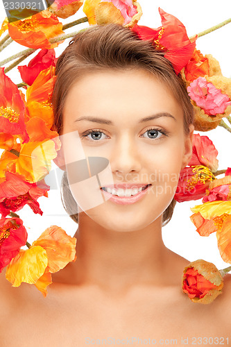 Image of lovely woman with red flowers