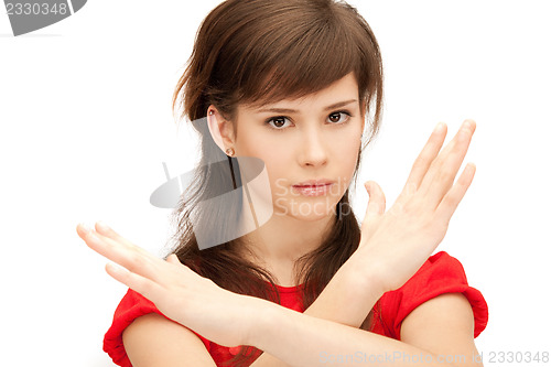 Image of teenage girl making stop gesture