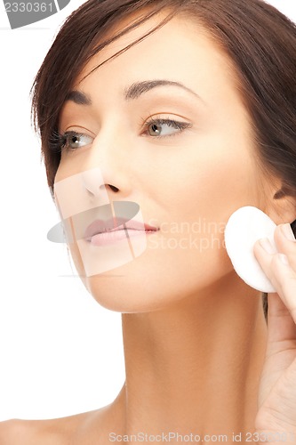 Image of beautiful woman with cotton pad