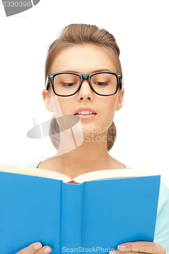 Image of calm and serious woman with book