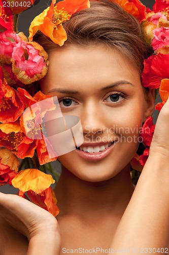 Image of lovely woman with red flowers