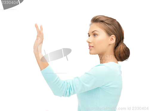 Image of businesswoman working with something imaginary