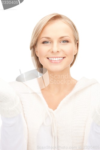 Image of beautiful woman in white sweater