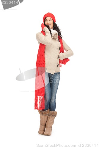 Image of beautiful woman in hat, muffler and mittens