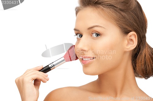 Image of beautiful woman with brush