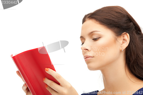 Image of calm and serious woman with book
