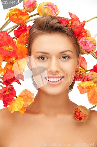 Image of lovely woman with red flowers