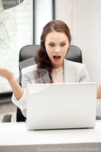 Image of happy woman with laptop computer