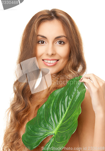 Image of woman with green leaf
