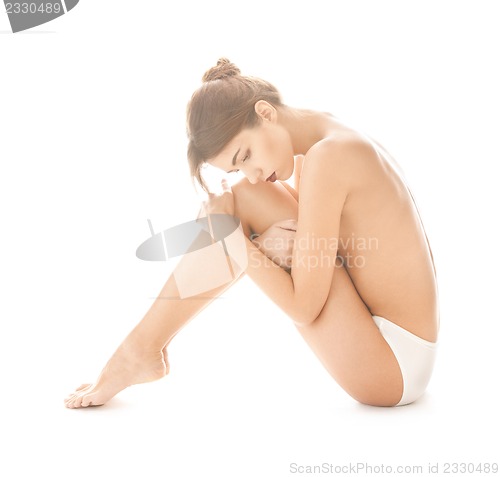 Image of beautiful topless woman in panties