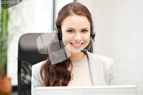Image of helpline operator with laptop computer