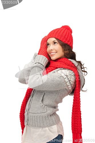 Image of beautiful woman in hat, muffler and mittens