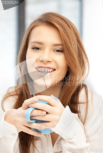 Image of lovely woman with mug