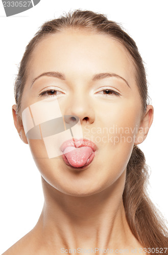 Image of teenage girl sticking out her tongue